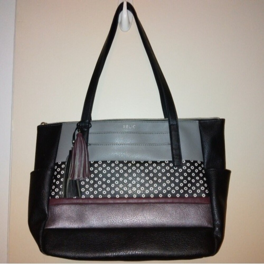 Relic tote bag purse zip top with tassels small spot on side see pic